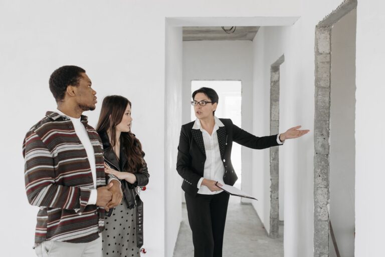Real estate agent showing a home to buyers using AI for real estate listings